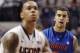 Florida's Scottie Wilbekin, right, watches Connecticut's Shabazz Napier shoot a free throw during the first half of an NCAA college basketball game, Monday, Dec. 2, 2013, in Storrs, Conn. (AP Photo/Jessica Hill)