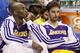 Los Angeles Lakers guard Kobe Bryant, left, and center Paul Gasol, right, watch from the bench in the fourth quarter of an NBA basketball game against the Oklahoma City Thunder in Oklahoma City, Friday, Dec. 13, 2013. Oklahoma City won 122-97. (AP Photo/Sue Ogrocki)