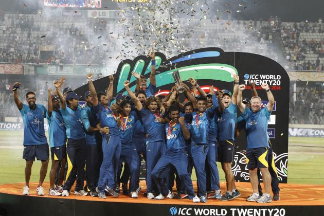 Sri Lanka’s players and team officials pose for a group photo while celebrating with the trophy after winning the ICC Twenty20 Cricket World Cup in Dhaka, Bangladesh, Sunday, April 6, 2014. Sri Lanka won the title defeating India by six wickets. (AP Photo/A.M. Ahad)
