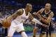 Oklahoma City Thunder forward Caron Butler drives around Utah Jazz forward Richard Jefferson (24) in the second quarter of an NBA basketball game in Oklahoma City, Sunday, March 30, 2014. (AP Photo/Sue Ogrocki)