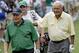 Jack Nicklaus, left, walks with Arnold Palmer on the second hole during the par 3 competition at the Masters golf tournament Wednesday, April 4, 2012, in Augusta, Ga. (AP Photo/David J. Phillip)