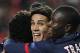 PSG's Edinson Cavani celebrates with team mates after scoring the opening goal during a Group C Champions League soccer match between Benfica and PSG at the Luz stadium in Lisbon, Tuesday Dec. 10, 2013. (AP Photo/Francisco Seco)