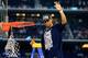 ARLINGTON, TX - APRIL 07: Shabazz Napier #13 of the Connecticut Huskies cuts down the net after defeating the Kentucky Wildcats 60-54 in the NCAA Men's Final Four Championship at AT&T Stadium on April 7, 2014 in Arlington, Texas. (Photo by Jamie Squire/Getty Images)