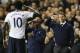 Tottenham's Emmanuel Adebayor, left, salutes to manager Tim Sherwood, right, after he scores a goal during the English Premier League soccer match between Tottenham Hotspur and Sunderland at White Hart Lane stadium in London, Monday, April 7, 2014. (AP Photo/Kirsty Wigglesworth)
