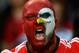 A Benfica supporter, his face painted with the team's mascot eagle, shouts during during their Portuguese league soccer match with Rio Ave Monday, April 7 2014, at Benfica's Luz stadium in Lisbon. Benfica won 4-0. (AP Photo/Armando Franca)