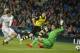 Real's Gareth Bale scores the opening goal beating Dortmund goalkeeper Roman Weidenfeller next to Dortmund's Lukasz Piszczek during a Champions League quarterfinal first leg soccer match between Real Madrid and Borussia Dortmund at the Santiago Bernabeu stadium in Madrid, Spain, Wednesday April 2, 2014. (AP Photo/Paul White)