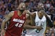 Miami Heat forward Udonis Haslem (40) and Boston Celtics forward Jeff Green (8) lock arms as they fight for position during a free throw in the first quarter of an NBA basketball game in Boston Wednesday, March 19, 2014. (AP Photo/Elise Amendola)