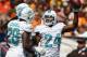 CLEVELAND, OH - SEPTEMBER 08: Cornerback Dimitri Patterson #24 of the Miami Dolphins celebrates with cornerback Nolan Carroll #28 after an interception against the Cleveland Browns at Cleveland Browns Stadium on September 8, 2013 in Cleveland, Ohio. (Photo by Matt Sullivan/Getty Images)