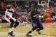 Apr 9, 2014; Washington, DC, USA; Charlotte Bobcats guard Kemba Walker (15) dribbles the ball as Washington Wizards guard John Wall (2) defends in the fourth quarter at Verizon Center. The Bobcats won 94-88 in overtime. Mandatory Credit: Geoff Burke-USA TODAY Sports