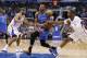 Oklahoma City Thunder guard Russell Westbrook, center, drives between Los Angeles Clippers forward Jared Dudley, left, and guard Chris Paul during the first half of an NBA basketball game in Los Angeles, Wednesday, April 9, 2014. (AP Photo/Danny Moloshok)