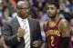 Cleveland Cavaliers coach Mike Brown, left, talks with Kyrie Irving during the first half of an NBA basketball game against the Memphis Grizzlies in Memphis, Tenn., Saturday, March 1, 2014. (AP Photo/Danny Johnston)