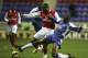 WIGAN, UNITED KINGDOM - DECEMBER 13: Emerson Boyce of Wigan Athletic challenges Julio Baptista of Arsenal during the Barclays Premiership match between Wigan Athletic and Arsenal at The JJB Stadium on December 13, 2006 in Wigan, England. (Photo by Alex Livesey/Getty Images)