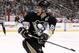 Pittsburgh Penguins' Sidney Crosby (87) works during a power play in the second period of an NHL hockey game against the Detroit Red Wings in Pittsburgh, Wednesday, April 9, 2014. The Penguins won 4-3 in a shootout. (AP Photo/Gene J. Puskar)