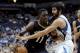 Minnesota Timberwolves guard Ricky Rubio, right, defends New Orleans Pelicans guard Jrue Holiday (11) during the first quarter of an NBA basketball game Wednesday, Jan. 1, 2014, in Minneapolis. (AP Photo/Hannah Foslien)