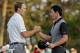 Jordan Spieth, left, shakes hands with Rory McIlroy, of Northern Ireland, on the 18th green following their second round of the Masters golf tournament Friday, April 11, 2014, in Augusta, Ga. (AP Photo/Charlie Riedel)