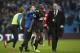 Wigan's Emmerson Boyce, centre, is congratulated by teammate Callum McManaman, centre left, after their 2-1 win against Manchester City following their English FA Cup quarterfinal soccer match at the Etihad Stadium, Manchester, England, Sunday, March 9, 2014. (AP Photo/Jon Super)
