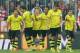 Dortmund players celebrate after scoring during the Bundesliga soccer match between FC Bayern Munich and Borussia Dortmund in Munich, Germany, on Saturday, April 12, 2014. (AP Photo/Kerstin Joensson)