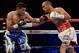 Apr 12, 2014; Las Vegas, NV, USA; Arash Usmanee (black gloves) and Ray Beltran (white gloves) during their NABO Lightweight Title fight at the MGM Grand Garden Arena. Mandatory Credit: Jayne Kamin-Oncea-USA TODAY Sports