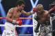 Manny Pacquiao, left, of the Philippines, drives Timothy Bradley into the ropes in their WBO welterweight title boxing bout Saturday, April 12, 2014, in Las Vegas. Pacquiao won by unanimous decision. (AP Photo/Isaac Brekken)