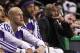 Los Angeles Lakers guard Kobe Bryant, fourth from left, sits on the bench as he watches teammates play against the Boston Celtics during the first quarter of an NBA basketball game in Boston, Friday, Jan. 17, 2014. Bryant has been sidelined after fracturing his left knee in December. (AP Photo/Charles Krupa)