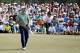 Jordan Spieth reacts as his ball misses the cup on the ninth hole for a birdie during the fourth round of the Masters golf tournament Sunday, April 13, 2014, in Augusta, Ga. (AP Photo/Matt Slocum)