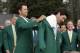 Defending Masters' champion Adam Scott, of Australia, helps Bubba Watson, right, with his green jacket after winning the Masters golf tournament Sunday, April 13, 2014, in Augusta, Ga. (AP Photo/Darron Cummings)