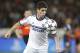 Chelsea's Oscar eyes the ball during the Champions League quarterfinal first leg soccer match between PSG and Chelsea, at the Parc des Princes stadium, in Paris, Wednesday, April 2, 2014. (AP Photo/Christophe Ena)