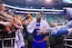 Fans reach for New York Knicks' Carmelo Anthony (7) as he walks off the court following their NBA basketball game against the Utah Jazz Monday, March 31, 2014, in Salt Lake City. The Knicks won 92-83. (AP Photo/Rick Bowmer)