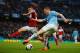 MANCHESTER, ENGLAND - MARCH 22: Patrick Roberts of Fulham goes into block the cross from James Milner of Manchester City lduring the Barclays Premier League match between Manchester City and Fulham at Etihad Stadium on March 22, 2014 in Manchester, England. (Photo by Michael Regan/Getty Images)