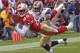 San Francisco 49ers wide receiver Brandon Lloyd catches a touchdown pass in front of St. Louis Rams cornerback DaeJuan Groce in the second quarter on Sunday, Nov. 2, 2003 in San Francisco. (AP Photo/Paul Sakumas)
