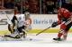 Nashville Predators goalie Pekka Rinne (35) blocks a shot by Chicago Blackhawks' Patrick Sharp (10) during the second period of an NHL hockey game in Chicago, Friday, March 14, 2014. (AP Photo/Nam Y. Huh)