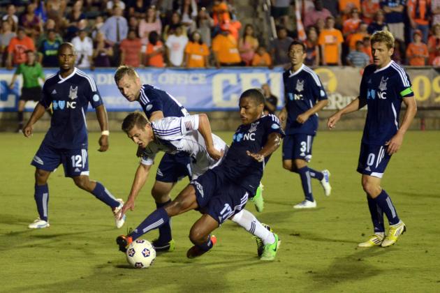 May 29, 2013; Cary, NC, USA;  Carolina Railhawks defender Jordan Graye (17) plays the ball away as Los Angeles Galaxy midfielder Robbie Rogers (14) pressures during a third round US Open Cup match at Wake Med Soccer Park. Carolina won 2-0.  Mandatory Credit: Rob Kinnan-USA TODAY Sports