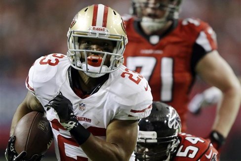 FILE- In this Jan. 20, 2013, file photo, San Francisco 49ers' LaMichael James (23) gets away from Atlanta Falcons' Stephen Nicholas (54) for a 15-yard touchdown run during the first half of the NFC championship NFL football game in Atlanta. James has transformed himself from a rookie spectator forced to watch the first three months of the season to a key contributor to a Super Bowl team in a matter of weeks for the San Francisco 49ers.(AP Photo/David Goldman, File))