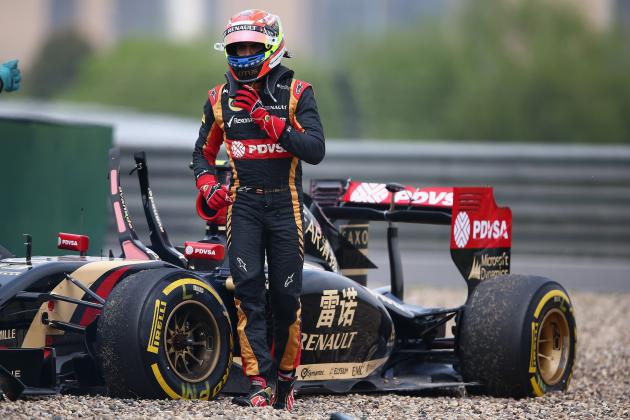 SHANGHAI, CHINA - APRIL 18: Pastor Maldonado of Venezuela and Lotus walks away from his car after crashing off the track during practice ahead of the Chinese Formula One Grand Prix at the Shanghai International Circuit on April 18, 2014 in Shanghai, China. (Photo by Clive Mason/Getty Images)