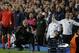 Chelsea's manager Jose Mourinho, on his knees as he watches the final moments of the match as Chelsea defeat Paris Saint-Germain in the Champions League quarterfinal second leg soccer match between Chelsea and Paris Saint Germain at Stamford Bridge stadium in London, Tuesday, April 8, 2014. Chelsea advance to the semifinals. (AP Photo/Matt Dunham).