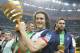 Paris Saint Germain's Edinson Cavani of Argentina, center, and goalkeeper Salvatore Sirigu, right, pose with the trophy after winning the French League Cup Final soccer match against Lyon at the Stade de France in Saint Denis, north of Paris, Saturday April 19, 2014. (AP Photo/Jacques Brinon)