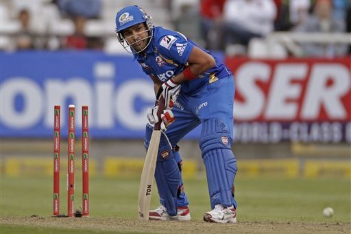 Mumbai Indians Rohit Sharma, looks up after the ball hit his wicket against Yorkshire during the Champions League Twenty20 in Cape Town, South Africa, Thursday, Oct 18, 2012. (AP Photo/Schalk van Zuydam)