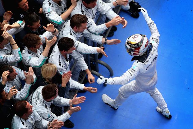 SHANGHAI, CHINA - APRIL 20:  Lewis Hamilton of Great Britain and Mercedes GP celebrates his victory with his team following the Chinese Formula One Grand Prix at the Shanghai International Circuit on April 20, 2014 in Shanghai, China.  (Photo by Clive Mason/Getty Images)
