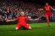 LONDON, ENGLAND - DECEMBER 29: Martin Skrtel of Liverpool celebrates with teammate Luis Suarez (R) after scoring the opening goal during the Barclays Premier League match between Chelsea and Liverpool at Stamford Bridge on December 29, 2013 in London, England. (Photo by Clive Rose/Getty Images)