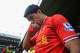 Liverpool's Martin Skrtel, left, celebrates with teammate Luis Suarez after their team beats Manchester City 3-2 in their English Premier League soccer match at Anfield Stadium, Liverpool, England, Sunday April 13, 2014. (AP Photo/Jon Super)