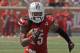 Louisville's Calvin Pryor turns and runs after picking off a pass against Eastern Kentucky in their NCAA college football game in Louisville, Ky., Saturday, Sept. 7, 2013. Louisville beat Eastern Kentucky 44-7. (AP Photo/Garry Jones)