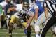 Notre Dame offensive tackle Zack Martin, back, faces off against Air Force in the first quarter of an NCAA football game at the Air Force Academy, Colo., on Saturday, Oct. 26, 2013. (AP Photo/David Zalubowski)