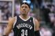 TORONTO, ON - APRIL 19: Paul Pierce #34 of the Brooklyn Nets reacts to a play against the Toronto Raptors in Game One of the NBA Eastern Conference play-off at the Air Canada Centre on April 19, 2014 in Toronto, Ontario, Canada. The Nets defeated the Raptors 94-87 to take a 1-0 series lead. NOTE TO USER: user expressly acknowledges and agrees that, by downloading and/or using this Photograph, user is consenting to the terms and conditions of the Getty Images License Agreement. (Photo by Claus Andersen/Getty Images)