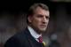 Liverpool's manager Brendan Rodgers takes to the touchline before his team's English Premier League soccer match against Tottenham at Anfield Stadium, Liverpool, England, Sunday March 30, 2014. (AP Photo/Jon Super)