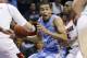 Louisville's Chris Jones (3) pressures North Carolina's Marcus Paige (5) during the first half of an NCAA college basketball game in the Basketball Hall of Fame Tip-Off tournament championship in Uncasville, Conn., Sunday, Nov. 24, 2013. (AP Photo/Michael Dwyer)