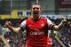 Lukas Podolski celebrates one of his two goals against Hull City last weekend.