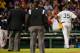 Home plate umpire Gerry Davis, right, confers on the mound with New York Yankees starting pitcher Michael Pineda, left; shortstop Derek Jeter (2); and others in the second inning of a baseball game against the Boston Red Sox at Fenway Park in Boston, Wednesday, April 23, 2014. Pineda was ejected after umpires found with a foreign substance on his neck.(AP Photo/Elise Amendola)