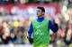 STOKE ON TRENT, ENGLAND - MARCH 01: Mesut Ozil of Arsenal warms up as a substitute during the Barclays Premier League match between Stoke City and Arsenal at Britannia Stadium on March 1, 2014 in Stoke on Trent, England. (Photo by Laurence Griffiths/Getty Images)