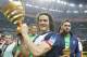 Paris Saint Germain's Edinson Cavani of Argentina, center, and goalkeeper Salvatore Sirigu, right, pose with the trophy after winning the French League Cup Final soccer match against Lyon at the Stade de France in Saint Denis, north of Paris, Saturday April 19, 2014. (AP Photo/Jacques Brinon)