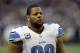 Detroit Lions defensive tackle Ndamukong Suh walks on the field during the first half of an NFL football game against the Minnesota Vikings, Sunday, Dec. 29, 2013, in Minneapolis. (AP Photo/Jim Mone)